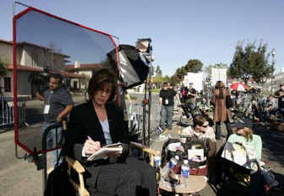 
Court TV correspondent Diane Dimond adds to her notes in the media area in front of the Santa Barbara County courthouse in Santa Maria, Calif., last Tuesday  as the media wait for Michael Jackson to leave for lunch during the second day of jury selection in his child molestation case
 (Associated Press / The Spokesman-Review)