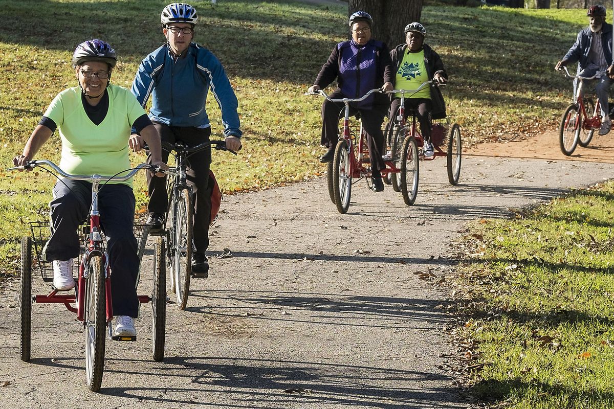 Maria G. Pena, 63, left, leads the group of senior riders as Christopher Stranton, executive director and founder of the Ghisallo Cycling Initiative, second from left, follows along during a ride from at Conley-Guerrero Senior Activity Center on Tuesday, Dec. 8, 2015, in Austin, Texas.