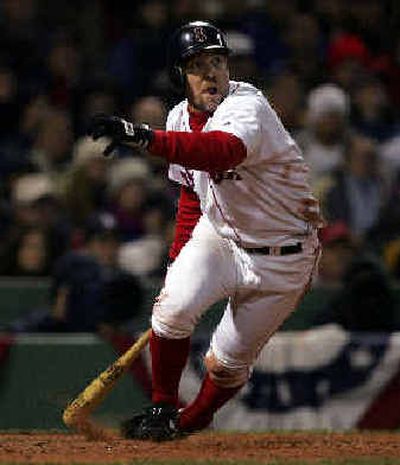 
Boston'sBill Mueller, who tied a World Series record with three errors, doubles off St. Louis starter Matt Morris.
 (Assoicated Press / The Spokesman-Review)