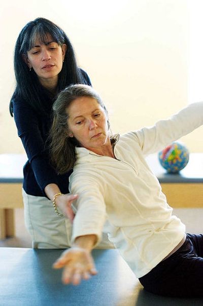 
Pilates instructor Miram Klinger, left, works with client Lindy Weaver at The Reform School in Greenwich, Conn.
 (Chris Preovolos/The Stamford Advocate / The Spokesman-Review)