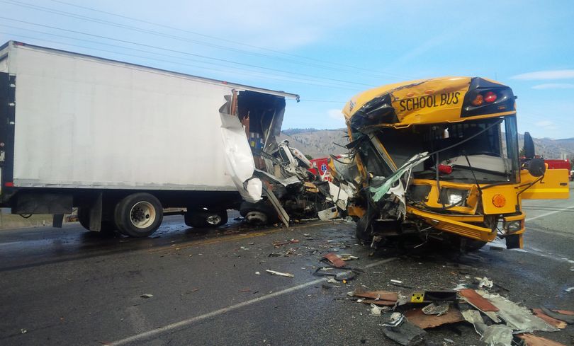 This Washington State Patrol photo shows the fatal wreckage of a school bus, box truck and a car Thursday near Orondo, Wash. The car’s driver was killed. (Associated Press)