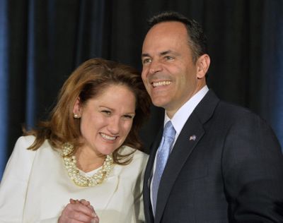 Kentucky Republican Gov.-elect Matt Bevin and his wife, Glenna, react to the cheers of supporters during his introduction at the Republican Party victory celebration Tuesday in Louisville, Ky. (Timothy D. Easley / Associated Press)