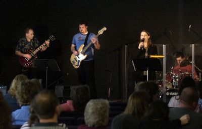 
Bill Taylor, far left, Dustin Warwick, Kelli Jones and Aaron Krueger play an opening hymn at the beginning of Sunday worship at Living Water Community Church. 
 (Liz Kishimoto / The Spokesman-Review)