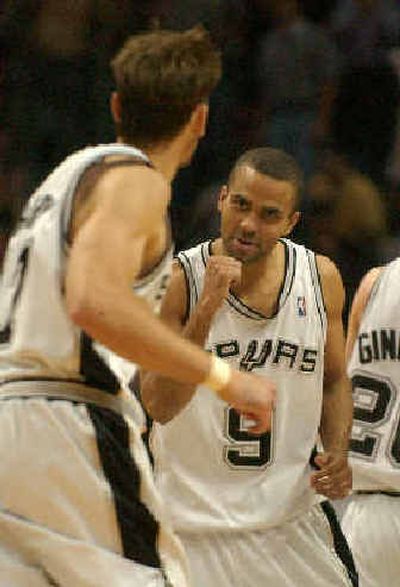 
San Antonio's Tony Parker, center, was a big factor in the Spurs' Game 1 victory with 29 points. 
 (Associated Press / The Spokesman-Review)