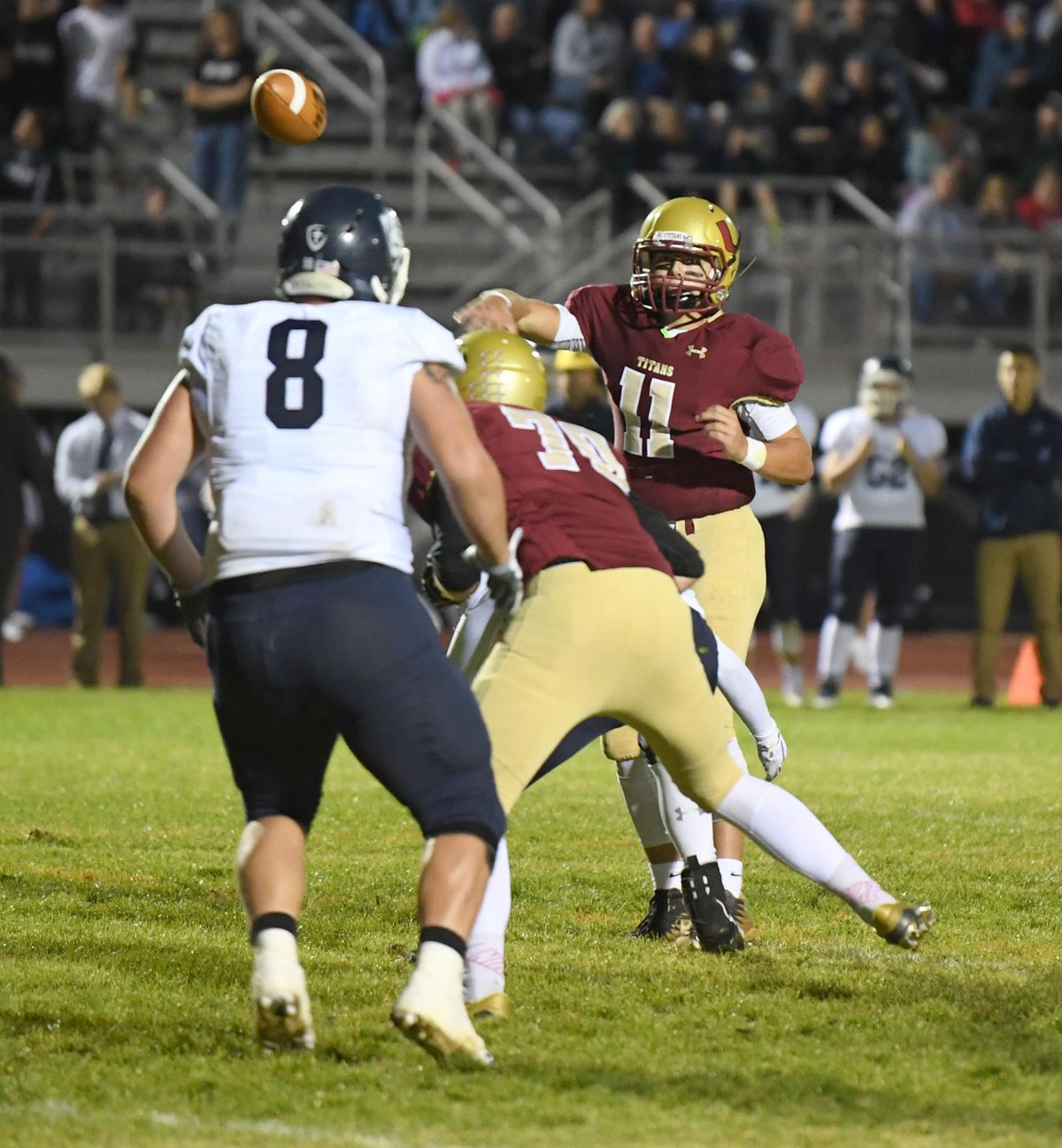 University High School quarterback Gavin Wolcott releases a short pass before he’s overrun run down Friday, Sept. 14, 2018 at University High during a game against Gonzaga Prep. (Jesse Tinsley / The Spokesman-Review)