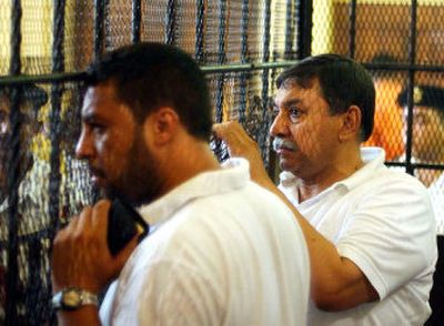 
Egyptian businessman Farouq al-Sha'ar, right, and his son Mohammed – defendants in an antiquities smuggling case – listen as a judge reads the verdict Saturday in Cairo. 
 (Associated Press / The Spokesman-Review)