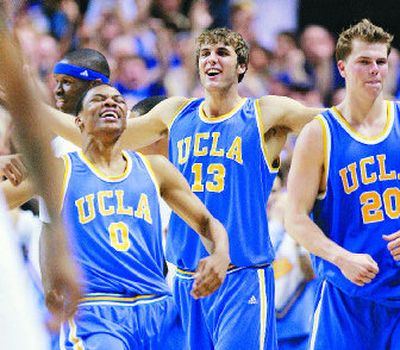 
UCLA's Russell Westbrook, James Keefe and Michael Roll, left to right, celebrate the Bruins' West Regional final win over Kansas. 
 (Associated Press / The Spokesman-Review)