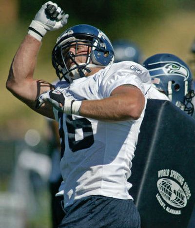 
Seahawks defensive end Grant Wistrom practices his pass rushing technique at camp. Foot, back and knee problems beleaguered him last season 
 (Associated Press / The Spokesman-Review)