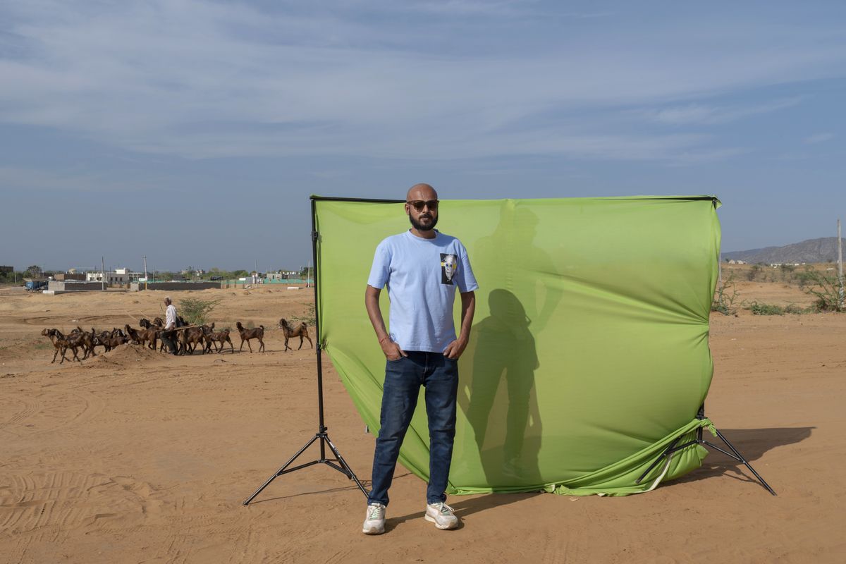 Divyendra Singh Jadoun, 31, a creator of deepfake content, poses against a green screen which he uses for generating videos using artificial intelligence in the deserts of Pushkar, India, on April 16. MUST CREDIT: Saumya Khandelwal for The Washington Post  (Saumya Khandelwal/for The Washington Post)