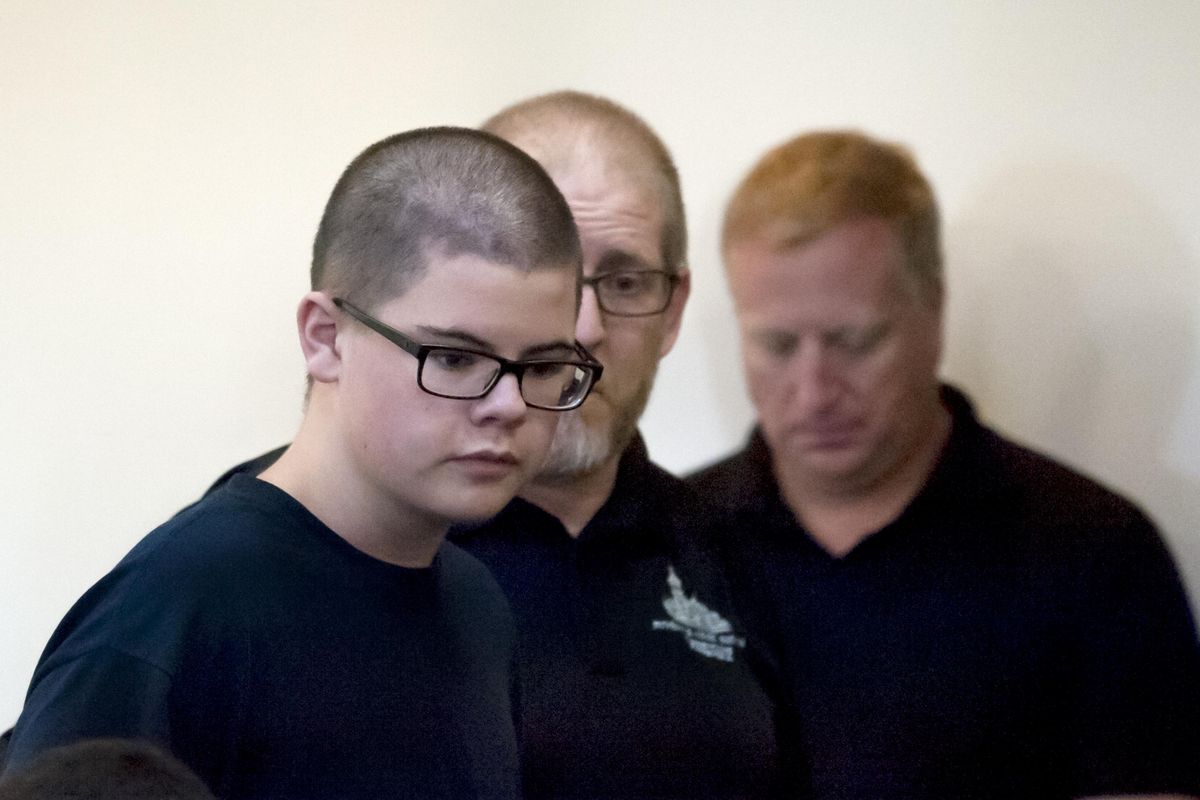 Caleb Sharpe, 15, walks into a packed Spokane County Juvenile Courtroom on Sept. 27, 2017. (Kathy Plonka / The Spokesman-Review)
