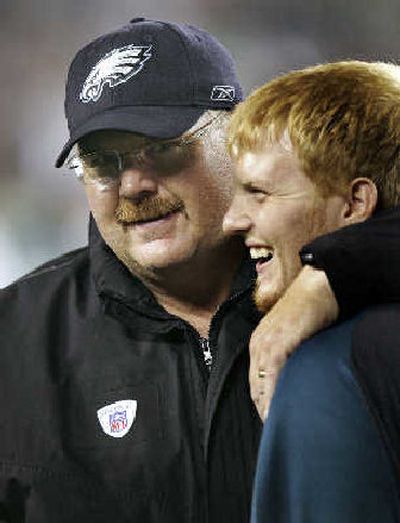 
Philadelphia head coach Andy Reid, left, hugs his son, Britt, after an Eagles' victory.
 (Associated Press / The Spokesman-Review)