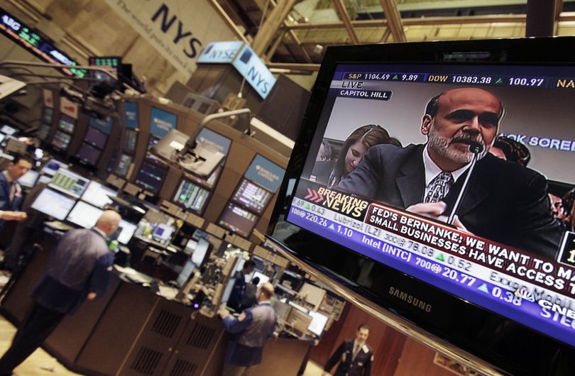 Fed Chairman Ben Bernanke is seen on a television screen on the floor of the New York Stock Exchange Wednesday, Feb. 24, 2010. (Richard Drew / Associated Press)