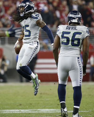 Richard Sherman celebrates one of his interceptions. (Associated Press)