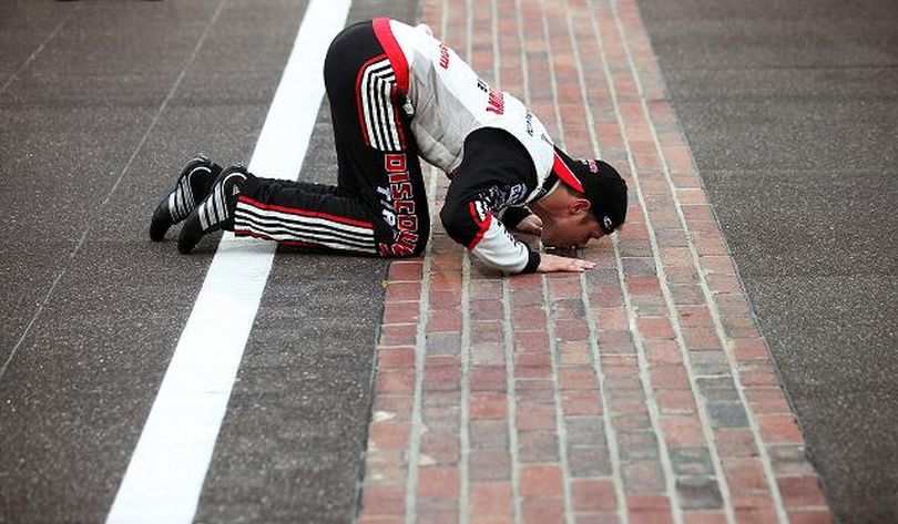 Brad Keselowski, driver of the #22 Snap-On Tools Dodge, kisses the bricks after winning the NASCAR Nationwide Series Indiana 250 at Indianapolis Motor Speedway on July 28, 2012 in Indianapolis, Indiana. (Photo by Nick Laham/Getty Images for NASCAR) (Nick Laham / Getty Images North America)