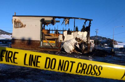 The 7-Eleven store at Fourth Street and Best Avenue in Coeur d'Alene burned along with other stores in the strip mall Saturday morning.
(Jesse Tinsley / The Spokesman-Review)