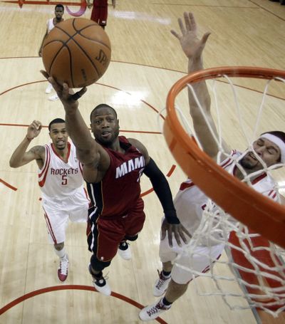 Dwyane Wade posted 45 points and seven rebounds to lead the Miami Heat over Houston 125-119.  (Associated Press)