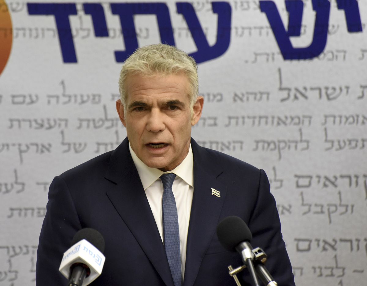 Chairman of the Yesh Atid Party, Yair Lapid, delivers a statement to the press in the Knesset, the Israeli Parliament, in Jerusalem, on Monday.  (DEBBIE HILL)