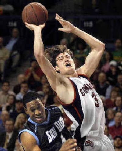 Adam Morrison of Gonzaga flies past Floyd North of San Diego to score and draw a foul. 
 (Christopher Anderson/ / The Spokesman-Review)
