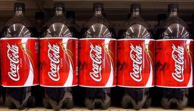 Shoppers can select from wide selection of Coca-Cola products in Springfield, Ill., Monday Feb. 6, 2006. The Coca-Cola Co., the world's largest beverage maker, reported Tuesday a 28 percent drop in fourth-quarter profit, but beat Wall Street expectations when certain one-time items are excluded. The Atlanta-based company said it earned $864 million, or 36 cents a share, for the three months ending Dec. 31, compared to a profit of $1.20 billion, or 50 cents a share, in the same period a year ago when Coke benefited from an insurance settlement and other matters. (AP Photo/Seth Perlman) ORG XMIT: ILSP103 (Seth Perlman / The Spokesman-Review)