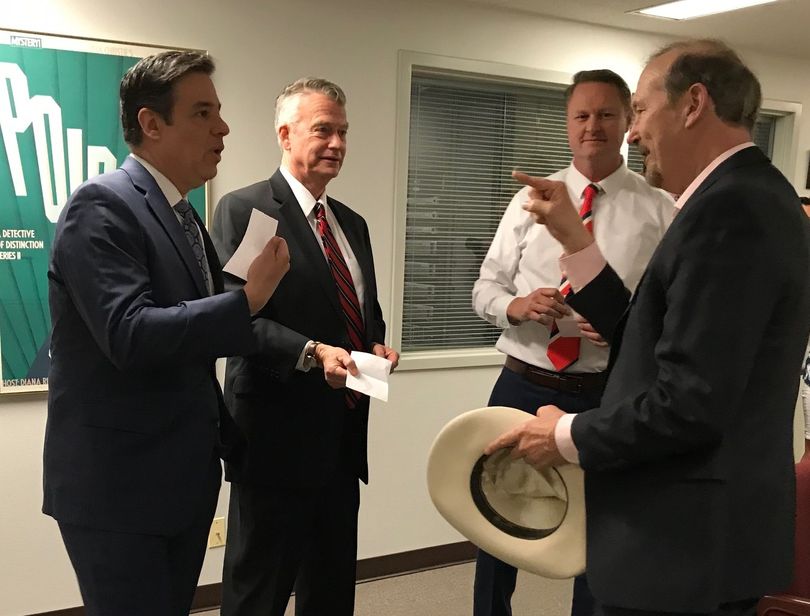 GOP gubernatorial candidates Raul Labrador, left, Brad Little and Tommy Ahlquist, with Bruce Reichert of Idaho Public Television, draw numbers from a hat to determine who will speak first in the 