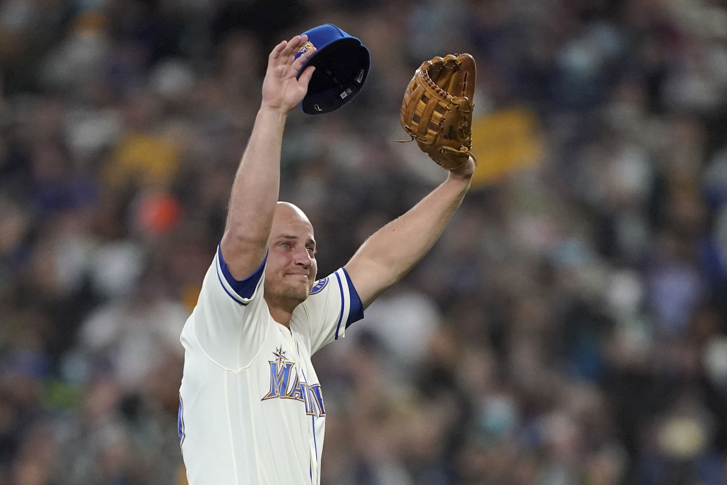 Crue Seager, the son of Seattle Mariners third baseman Kyle Seager throws  out the first pitch of a baseball game against the Los Angeles Angels,  Sunday, Oct. 3, 2021, in Seattle. (AP