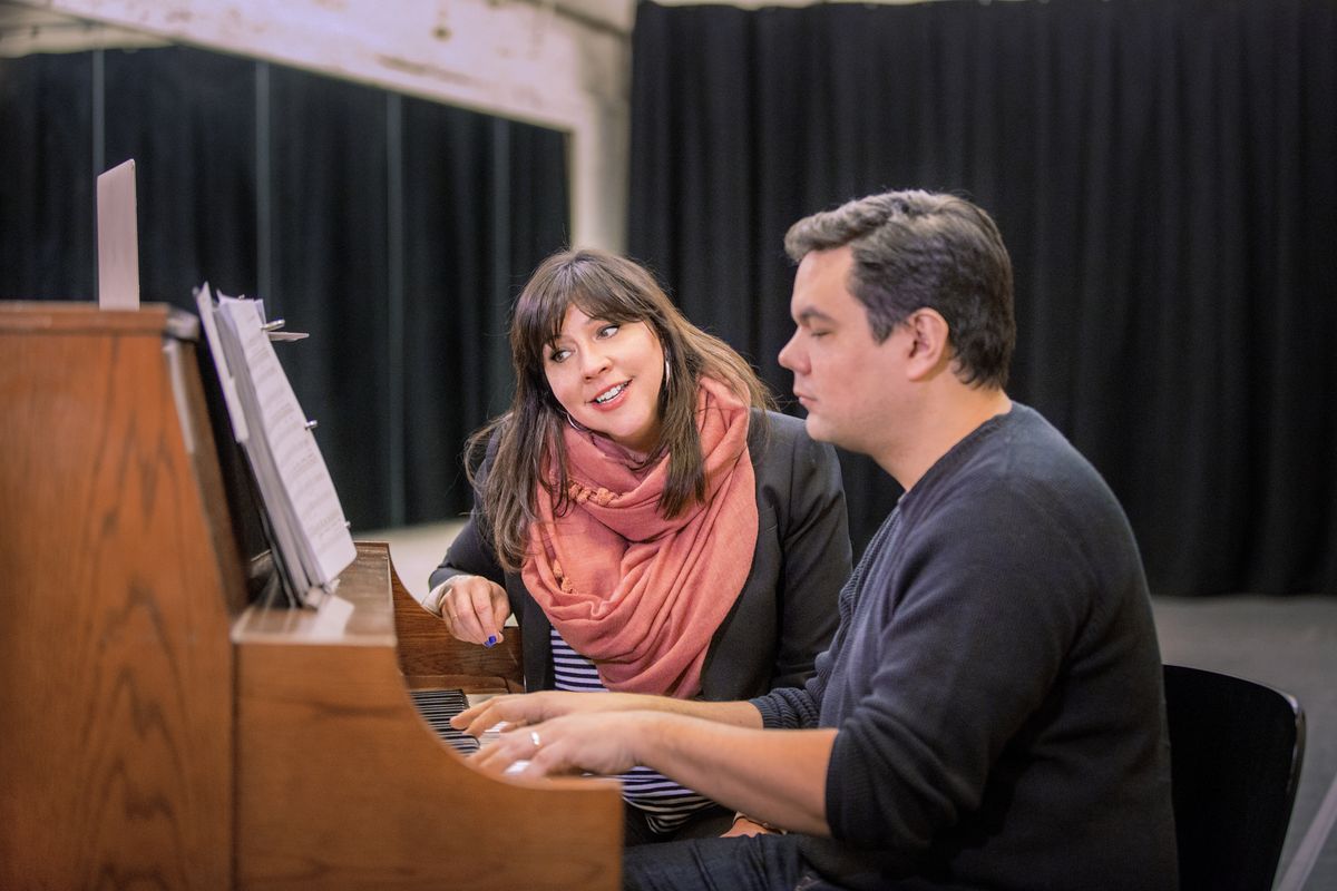 Kristen Anderson-Lopez sings as Robert Lopez plays piano. The music-writing duo crafted hits for the “Frozen” film franchise and since has adapted the songs for the musical stage.  (Courtesy of Disney Theatrical Group)