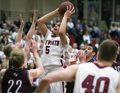 Whitworth guard Kenny Love looks to score in a crowd during first-half action on Thursday at Whitworth. (Colin Mulvany / The Spokesman-Review)