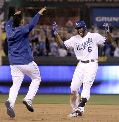 Kansas City’s Lorenzo Cain celebrates his winning single in 10th inning. (Associated Press)
