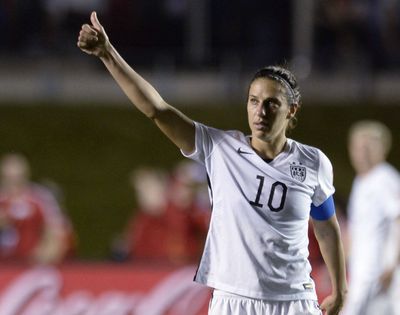 Carli Lloyd scored her 65th goal in her 200th international appearance, heading in the game’s only score. (Associated Press)