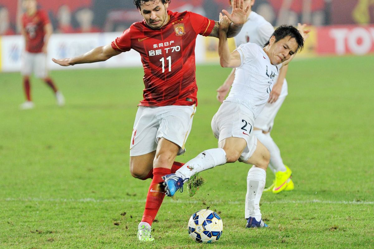 Brazilian forward Ricardo Goulart of Guangzhou Evergrande, left, was signed for a CSL-record $16.2 million. (Associated Press)