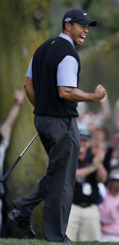 
Tiger Woods pumps his fist after making eagle on the 13th hole Saturday. Associated Press
 (Associated Press / The Spokesman-Review)