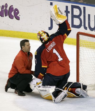Starting Florida goalie Roberto Luongo had to leave in the first period after taking a puck to the side of the head. (Associated Press)