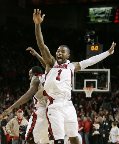 Terrence Williams (1) and Andre McGee enjoy their win.  (Associated Press / The Spokesman-Review)