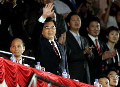 
President Hu Jintao waves during the opening ceremony of the Special Olympics World Summer Games in Shanghai on Oct. 2. Associated Press
 (Associated Press / The Spokesman-Review)