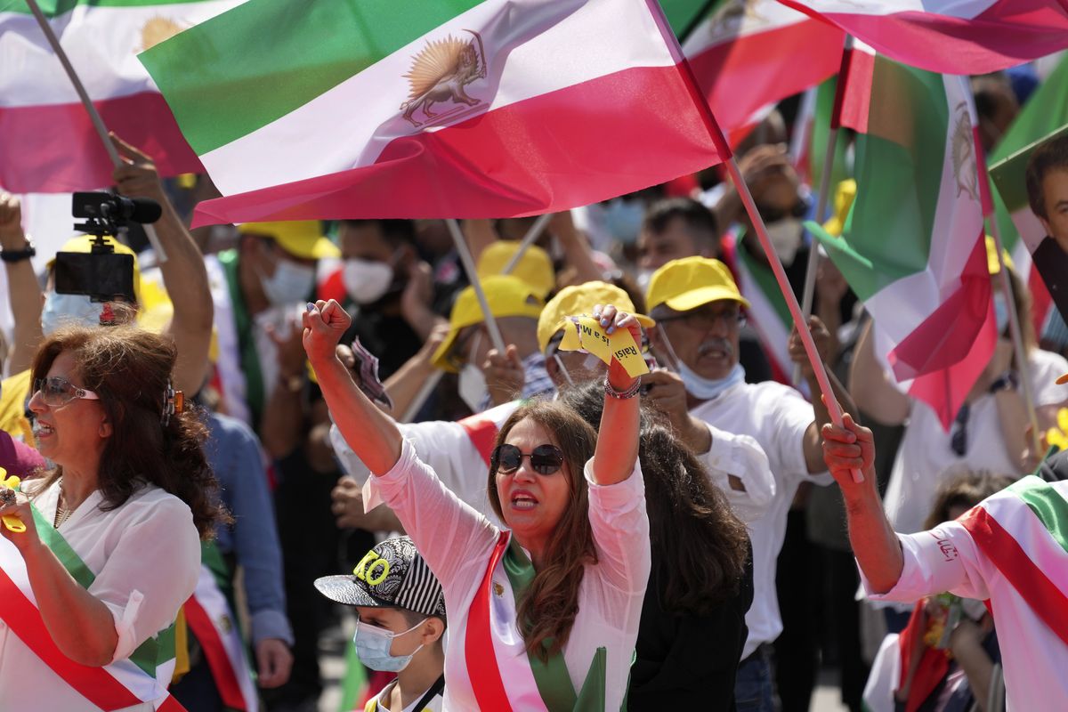 People attend a protest rally in Berlin, Germany, Saturday, July 10, 2021 as part of the 