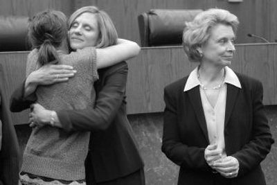 
Debra Stephens hugs her daughter, Lindsey, 16, after Gov. Chris Gregoire, right, appointed Stephens on Tuesday.
 (Dan Pelle / The Spokesman-Review)