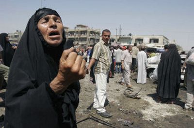 
A local woman breaks down at the scene of a massive car bomb attack Saturday in the Sadr City area of Baghdad. The car bomb exploded outside a popular market. 
 (Associated Press / The Spokesman-Review)