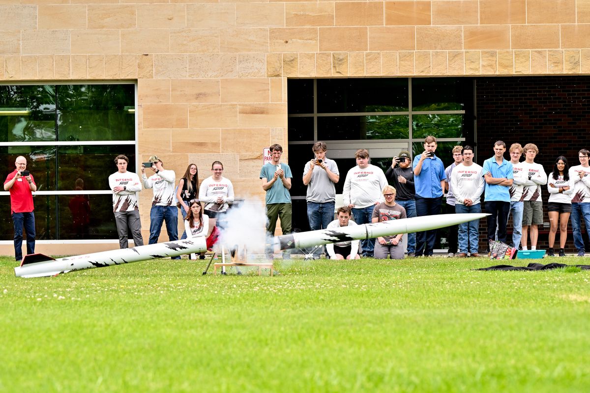 Members of the Eastern Washington University’s Aerospace Club perform a ground deployment test for their rocket’s parachute system on Wednesday at EWU’s campus in Cheney.  (Tyler Tjomsland/The Spokesman-Review)