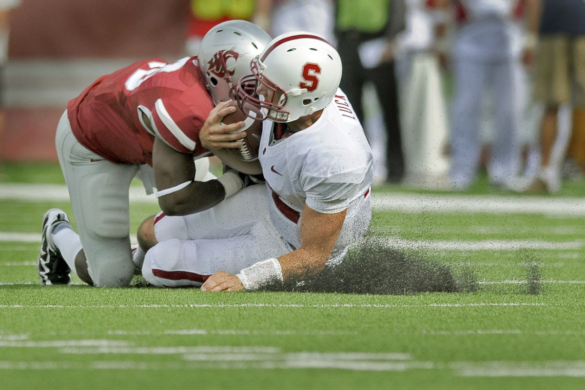 WSU linebacker #46 Louis Bland knocks heads with Stanford quarterback #12  Andrew Luck and has to leave the game for a few plays after this first half play at Martin Stadium in Pullman on Saturday, Sept. 5, 2009.    (Christopher Anderson / The Spokesman-Review)