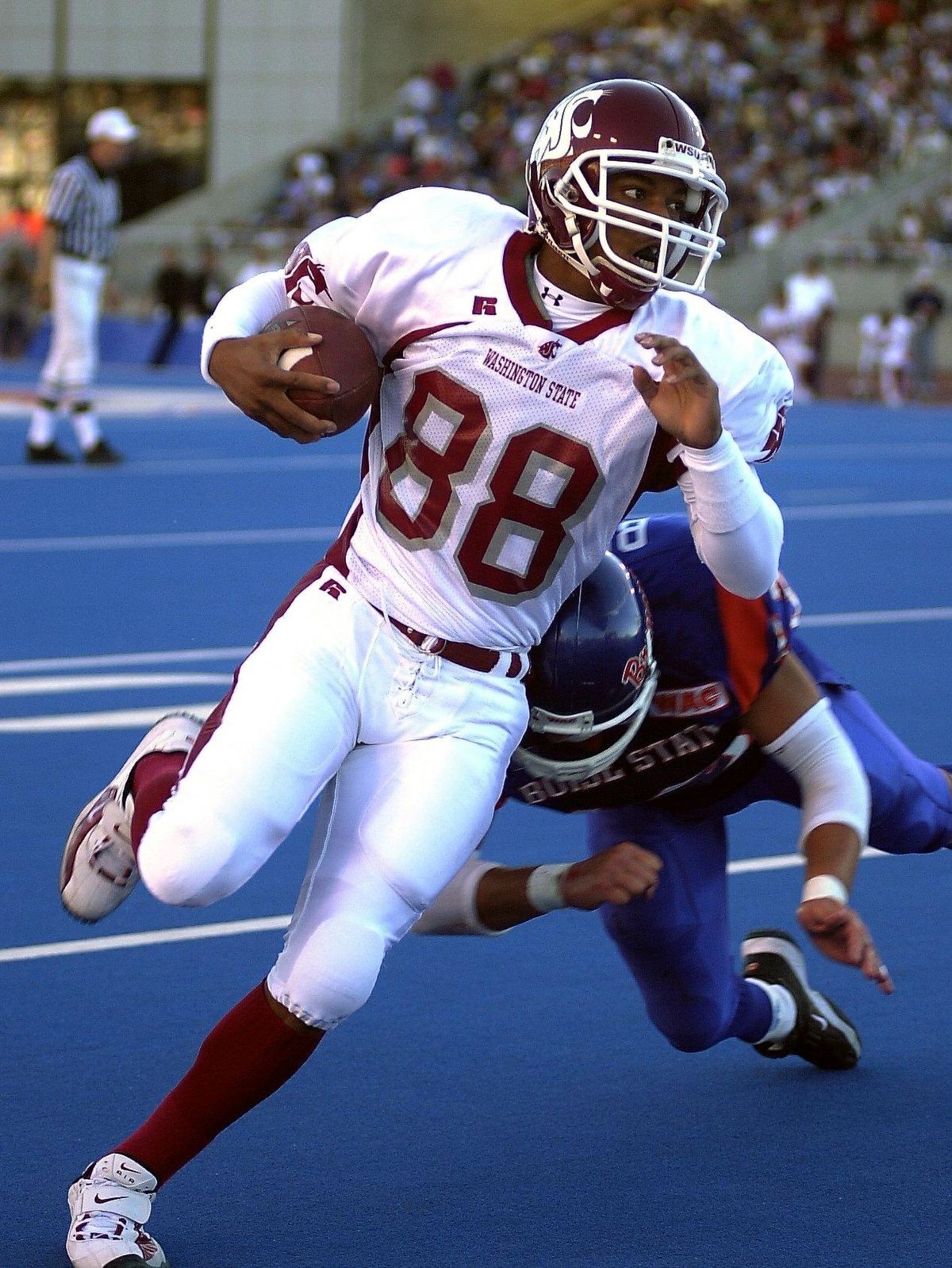 WSU’s Trandon Harvey runs past a Boise State defender during the Cougars’ 41-20 victory over the Broncos in September of 2001 in Boise. (BRAD TALBUTT / Associated Press)