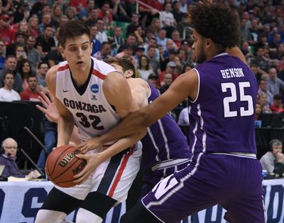 Northwestern center Barret Benson (25) tries to grab the ball from Gonzaga forward Zach Collins (32) during the first half Gonzaga’s victory in the second round of the NCAA Tournament, Saturday, March 18, 2017, in Salt Lake City. (Colin Mulvany / The Spokesman-Review)