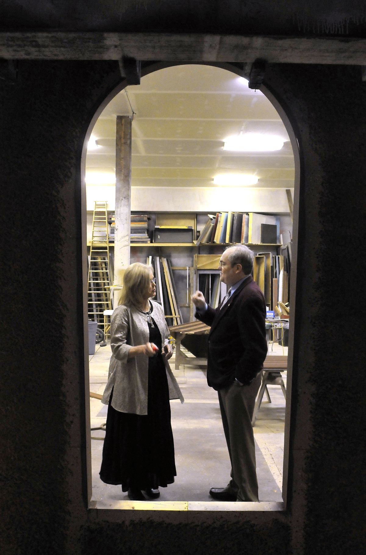 Spokane Interplayers Ensemble managers Pamela Brown and Reed McColm chat in the back shop where sets are built in the 1920s-vintage building on Friday. (Jesse Tinsley)