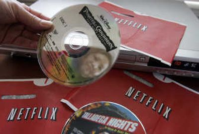 
Carleen Ho of Palo Alto, Calif., holds DVD movies she rented from Netflix. Associated Press
 (Associated Press / The Spokesman-Review)