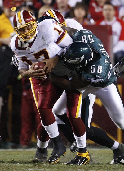 Redskins quarterback Jason Campbell is sacked in the second quarter. (Associated Press / The Spokesman-Review)