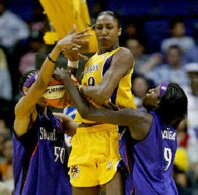
Los Angeles' Lisa Leslie, center, is smothered by Sacramento. 
 (Associated Press / The Spokesman-Review)