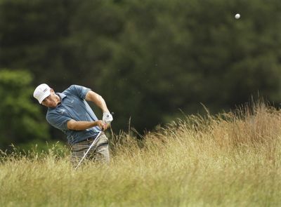 Ricky Barnes hits out of the rough on the 10th fairway during the third round on Sunday. He found  more trouble early in the final round.  (Associated Press / The Spokesman-Review)