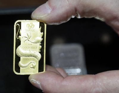 A Swiss gold coin is seen Wednesday at Numis International Inc. in Millbrae, Calif. (Associated Press)
