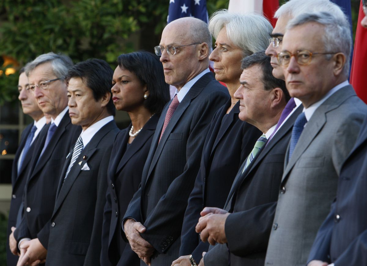 Associated Press Treasury Secretary Henry Paulson, center, listens as President Bush, not pictured, makes a statement in the Rose Garden. Pictured from left to right: Italy’s central bank governor Mario Draghi; Eurogroup’s Chairman Jean-Claude Juncker; Japan’s Finance Minister Shoichi Nakagawa; Secretary of State Condoleezza Rice; Paulson; France Finance Minister Christine Lagarde; Canada Finance Minister James M. Flaherty, Britain’s Chancellor of the Exchequer Alastair Darling; and Italy Finance Minister Giulio Tremonti. (Associated Press / The Spokesman-Review)