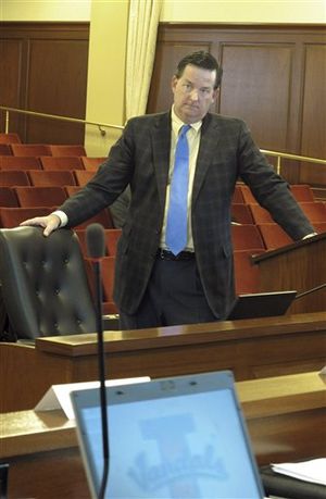 Robert Mitchell, an advisor with KPMG LLC hired by Idaho to advise the state on creating an insurance exchange, answers a question on Tuesday, Oct. 9, 2012, in the Idaho Capitol in Boise. Mitchell told members of a panel investigating the issue that it's likely too late for Idaho to set up a state-run exchange, and the state will likely have to work with the federal government to create a marketplace for small businesses and individuals to buy their insurance come 2014.  (AP / John Miller)