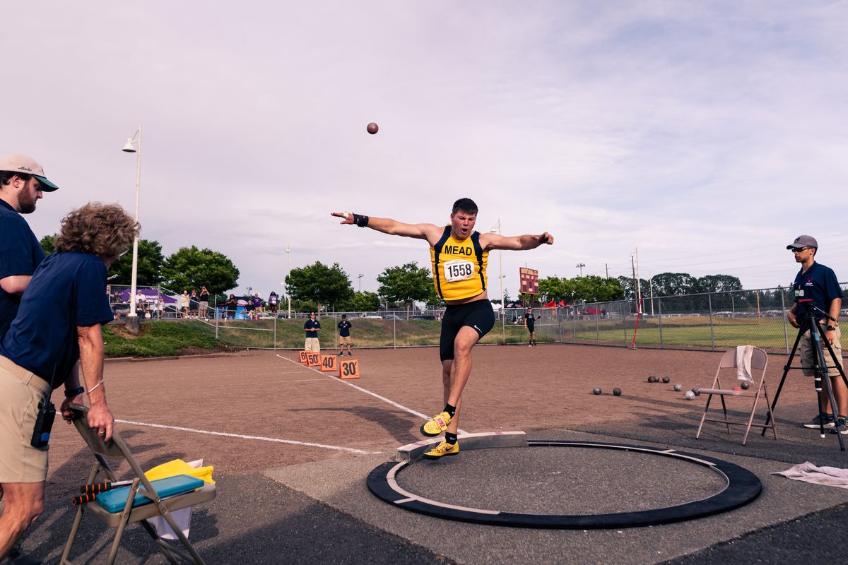 Mead’s Simon Rosselli lets fly an attempt in the 4A boys shot put at the WIAA State Track and Field Championships on Thursday, May 28, at Mount Tahoma High School in Tacoma. (Joshua Hart)